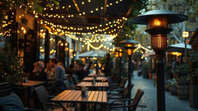 patio heaters at outdoor restaurant with string lights
